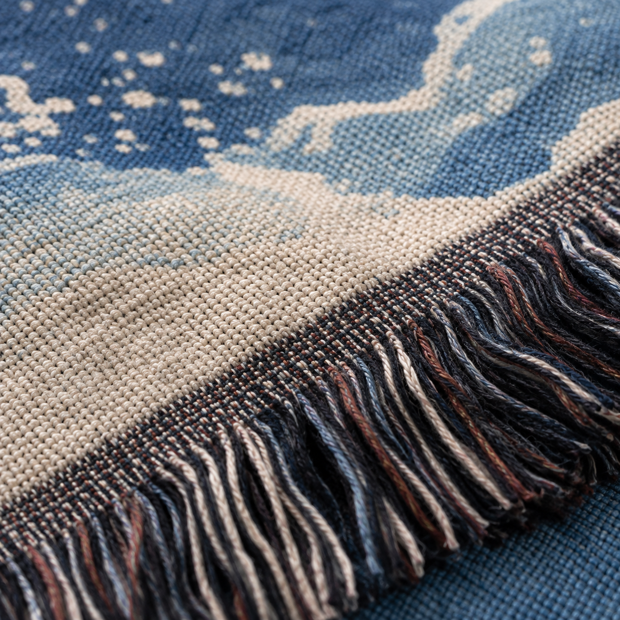 Macro close up of woven yarn texture and multicolor fringe on Matthew 14:27 blanket