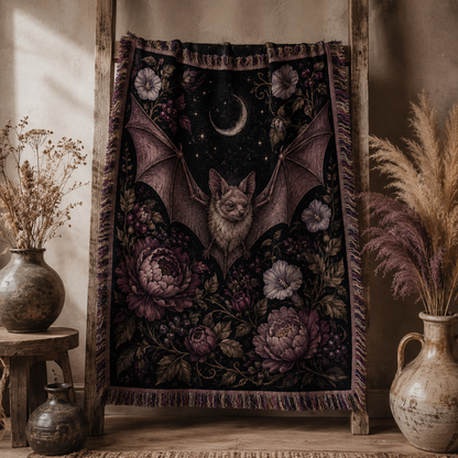 Moonlit bat botanical woven blanket displayed on a rustic wooden ladder
