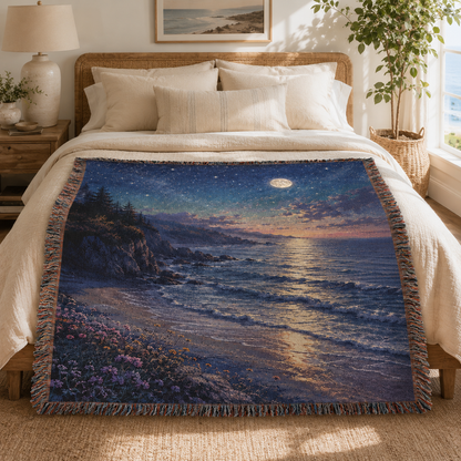 Moonlit ocean woven blanket styled across a bright coastal bedroom bed