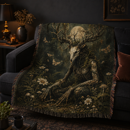 Dark woodland forest guardian woven throw blanket draped on a charcoal sofa