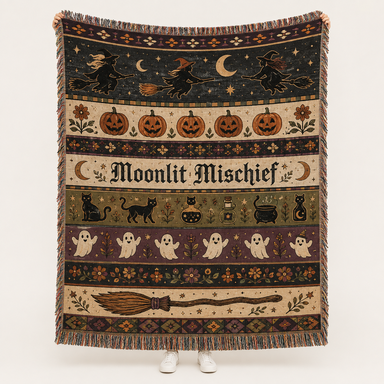 Moonlit Mischief Halloween woven blanket with witches, pumpkins, black cats, ghosts, crescent moons and fringe