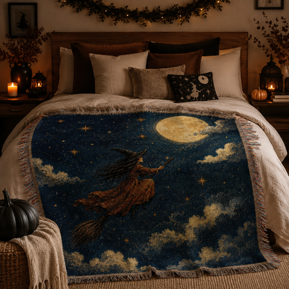 Moonlit witch Halloween woven blanket styled across a cozy autumn bedroom bed