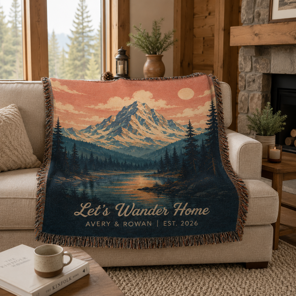 Personalized mountain lake woven blanket styled on a sofa in a rustic cabin living room