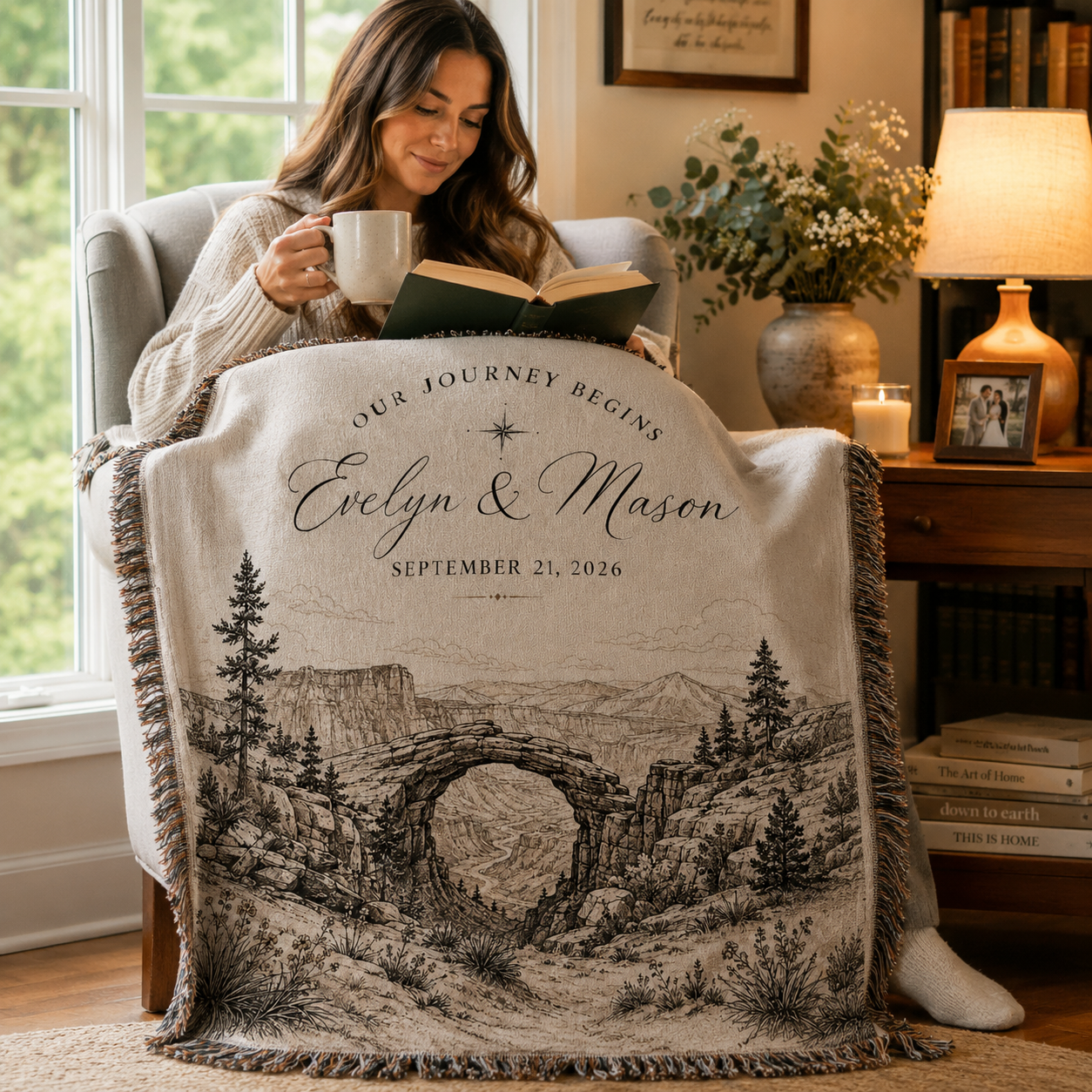 Woman reading with personalized adventure wedding woven blanket in a cozy reading nook