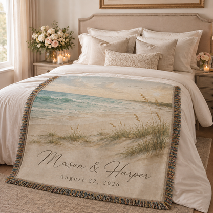 Personalized beach wedding woven blanket styled across a romantic bedroom bed