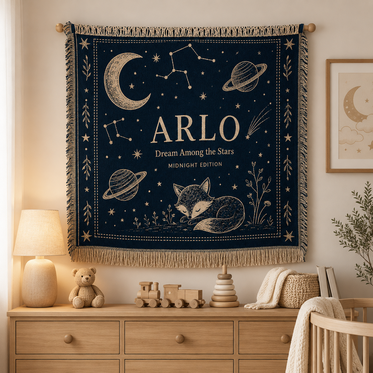 Personalized celestial nursery woven blanket displayed as wall decor above a wooden dresser