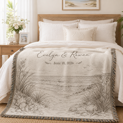 Personalized coastal beach wedding woven blanket styled across a romantic bedroom bed