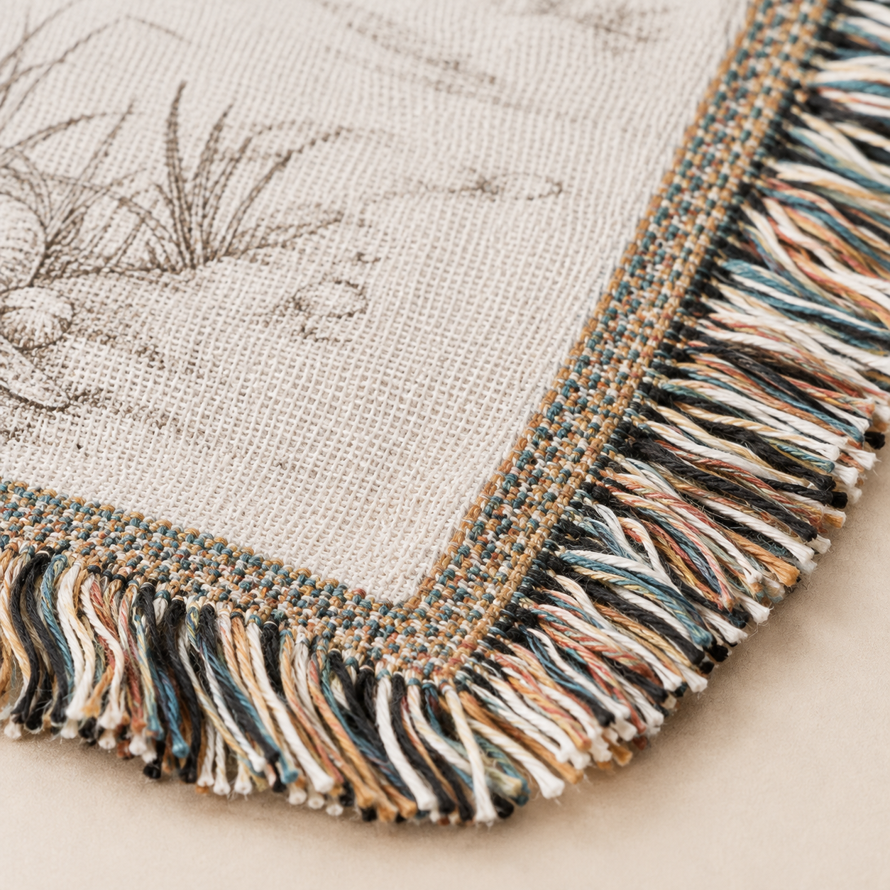 Macro woven texture and multicolor fringe detail of personalized coastal wedding blanket