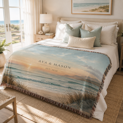 Personalized beach sunset woven blanket with couple names styled in a coastal bedroom