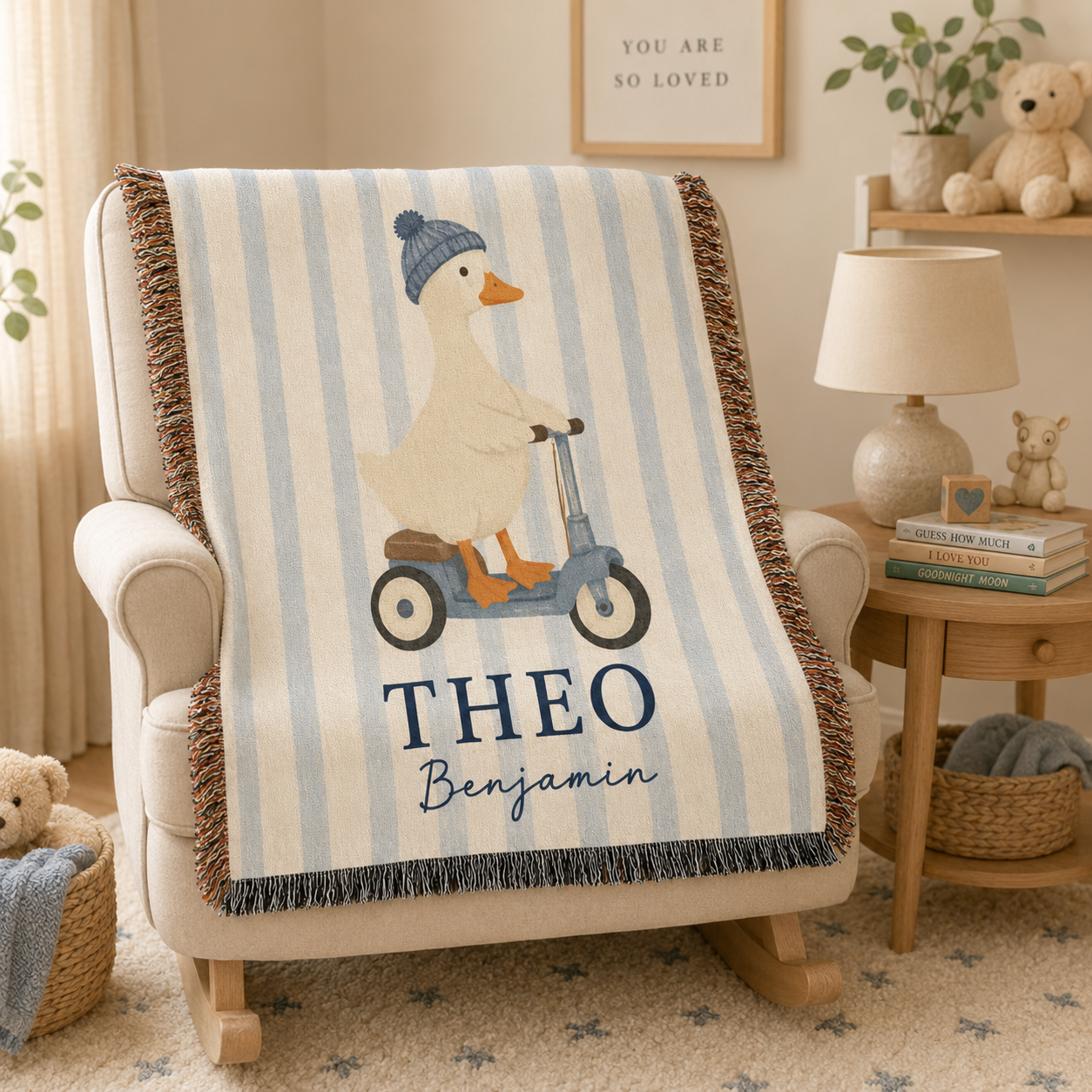Personalized baby woven blanket with duck scooter design draped over a nursery rocking chair