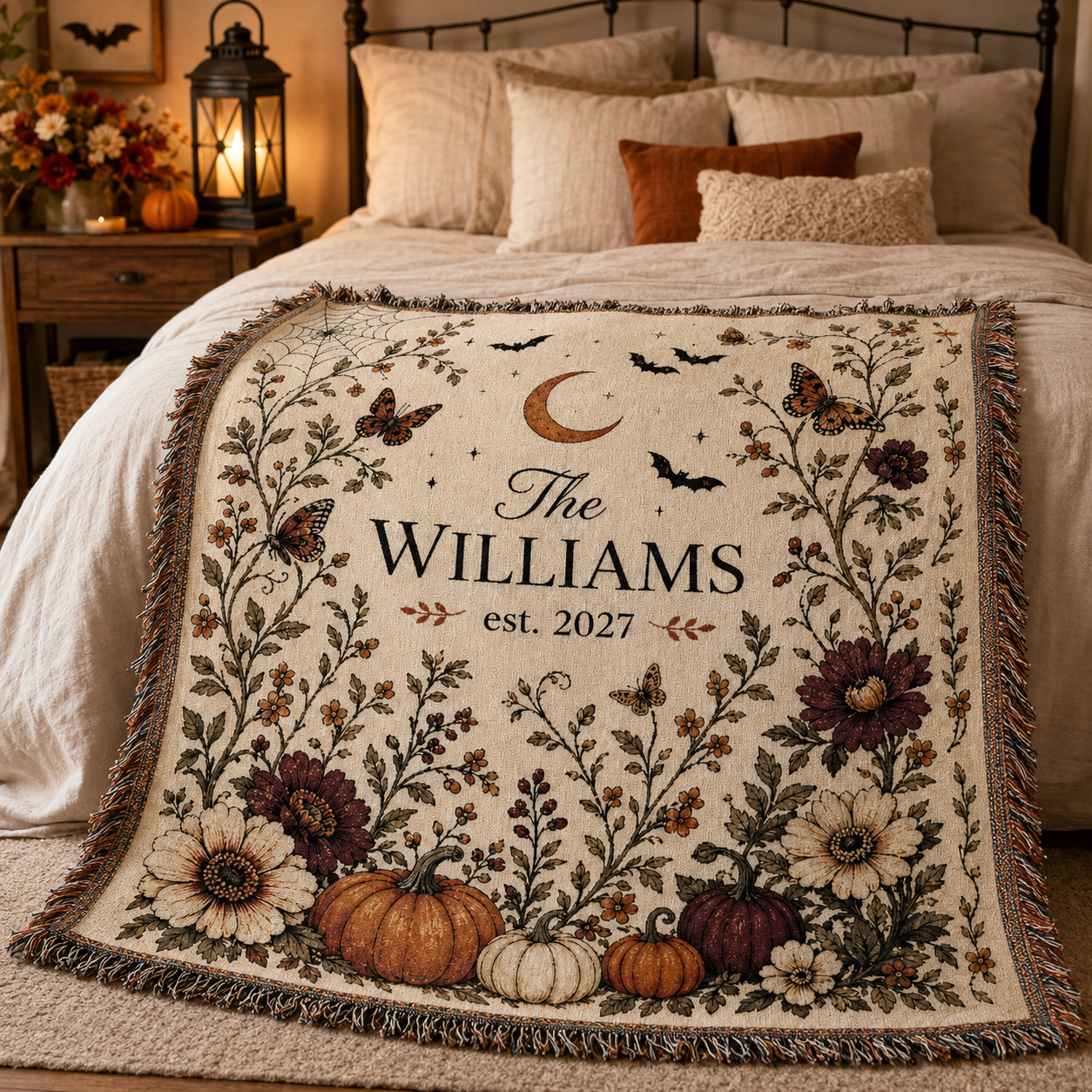 Personalized botanical Halloween woven blanket displayed across a cozy neutral bedroom with lantern light