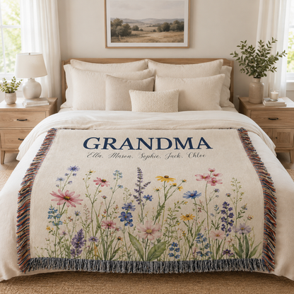 Personalized Grandma meadow wildflower woven blanket displayed on a warm neutral bedroom bed