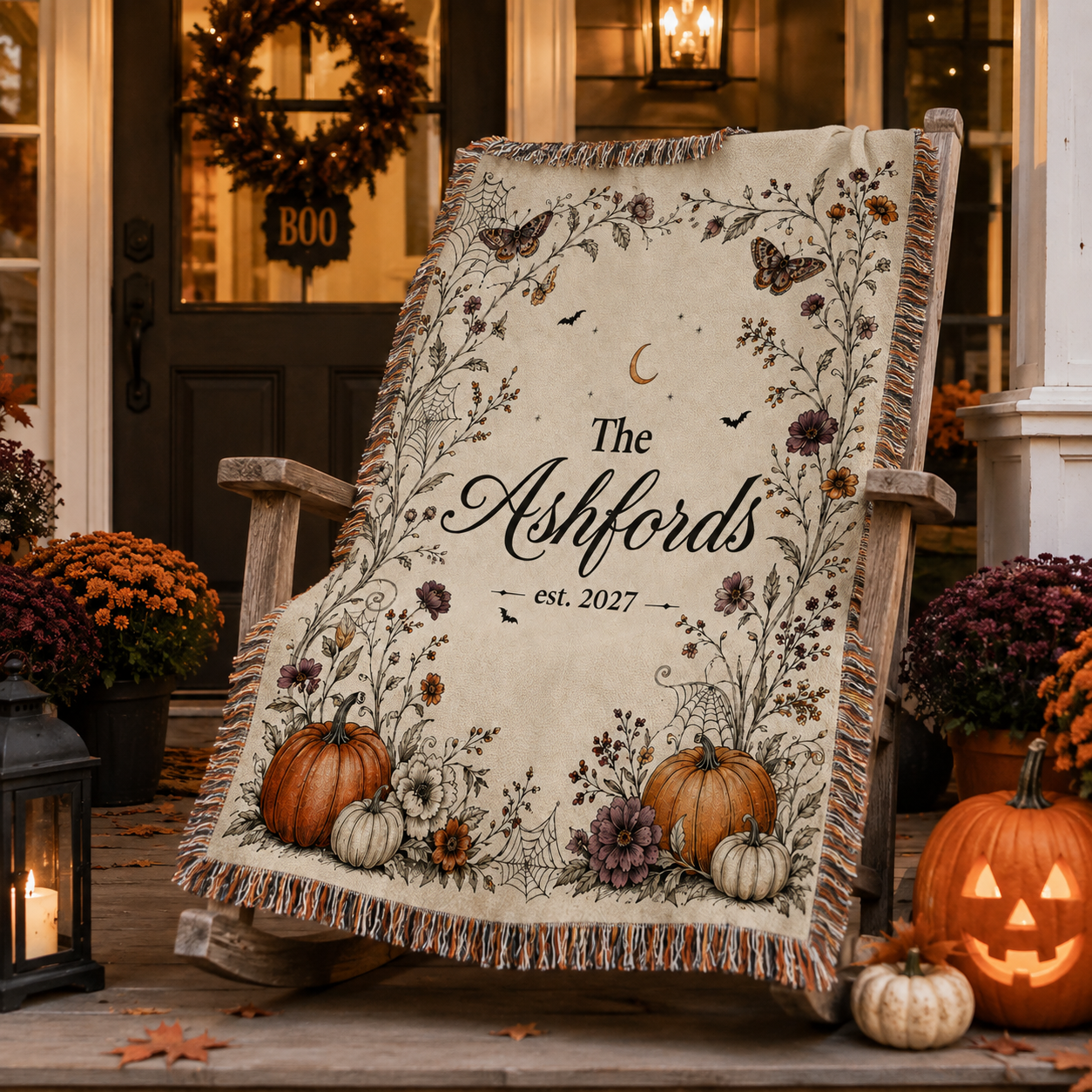 Personalized Halloween family name woven blanket displayed on an autumn porch with pumpkins and lanterns