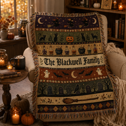 Personalized Halloween family woven blanket draped over a reading chair with books and candles
