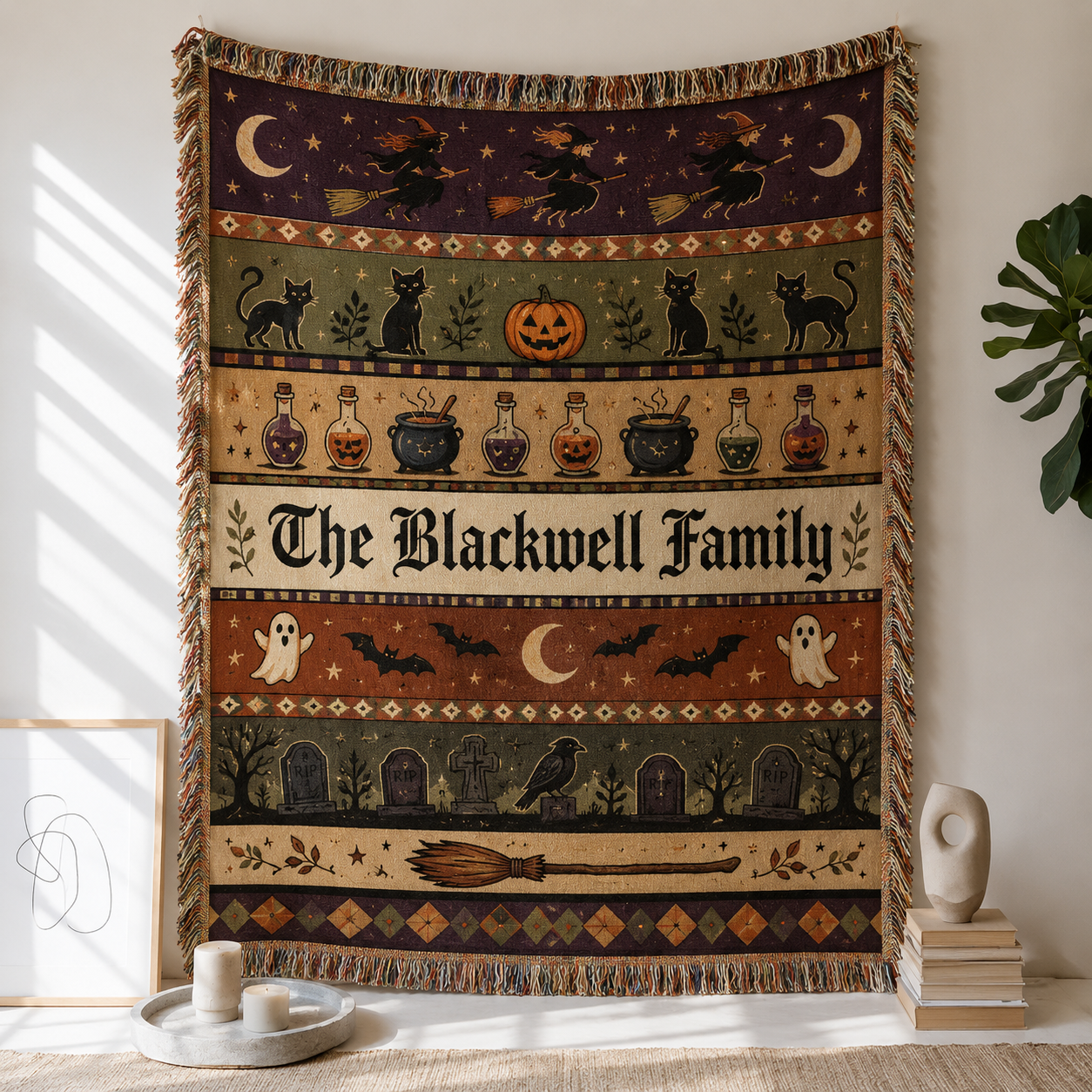 Personalized Halloween family name woven blanket with witches, black cats, potions, ghosts and graveyard folk art