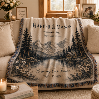 Personalized mountain lake wedding woven blanket softly draped on a sofa