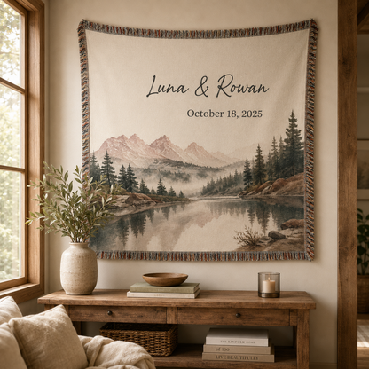Personalized mountain lake woven blanket displayed as wall tapestry with custom names and special date