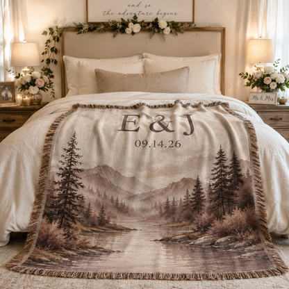 Personalized mountain lake wedding woven blanket styled across a romantic bedroom