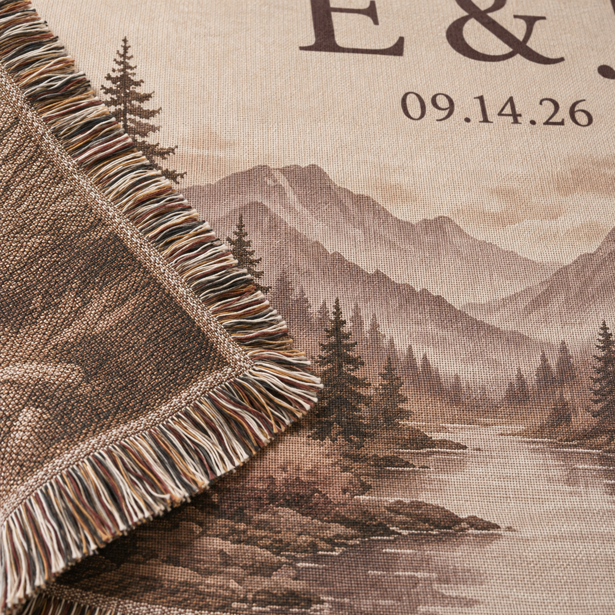 Macro close-up of woven texture and multicolor fringe on personalized mountain wedding blanket