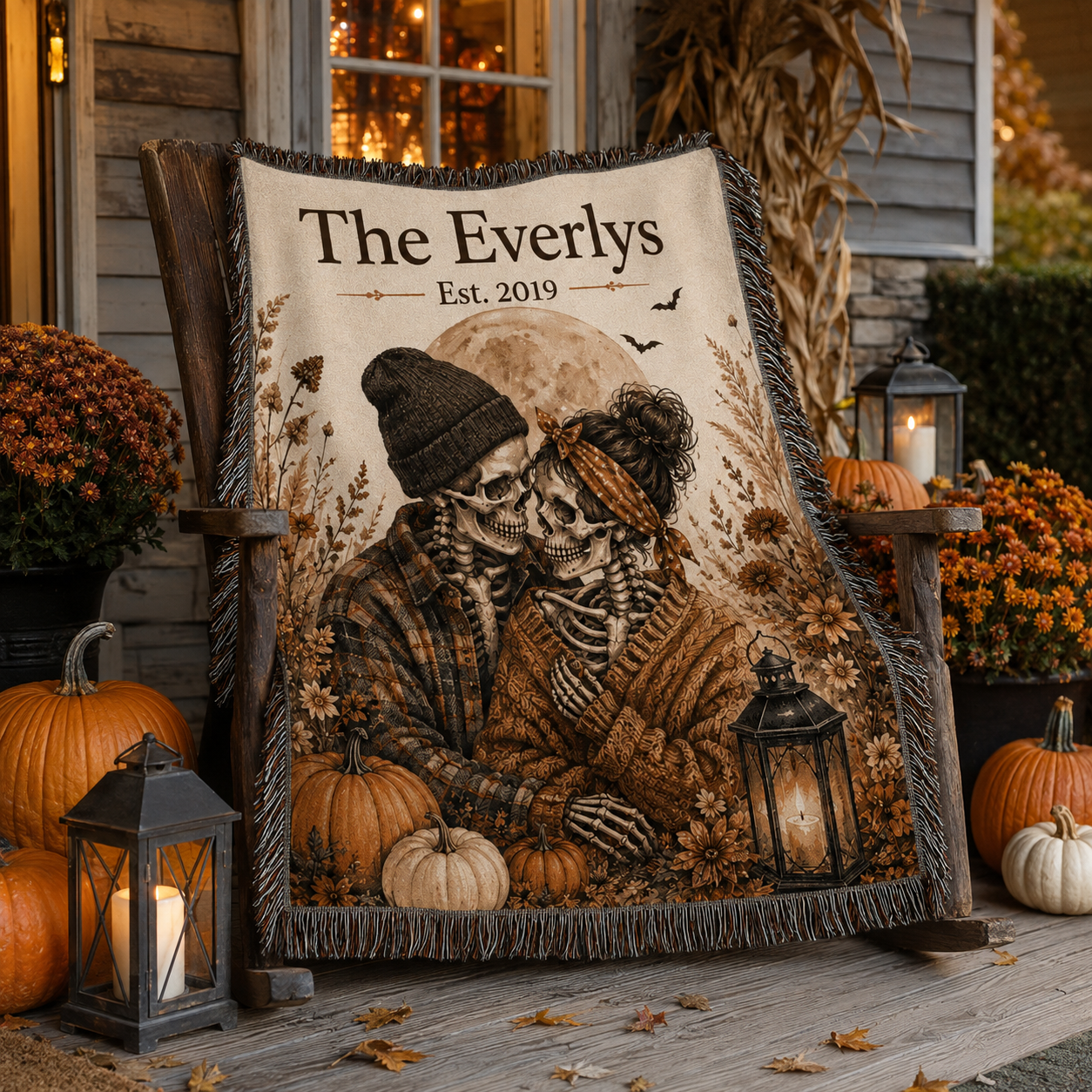 Personalized skeleton couple woven blanket displayed on an autumn Halloween porch