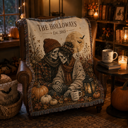 Personalized skeleton couple Halloween woven blanket draped over a leather chair in a candlelit reading nook