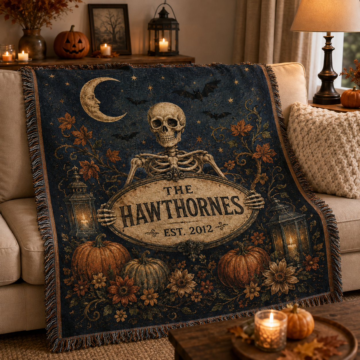 Personalized skeleton family woven blanket styled on a sofa for Halloween