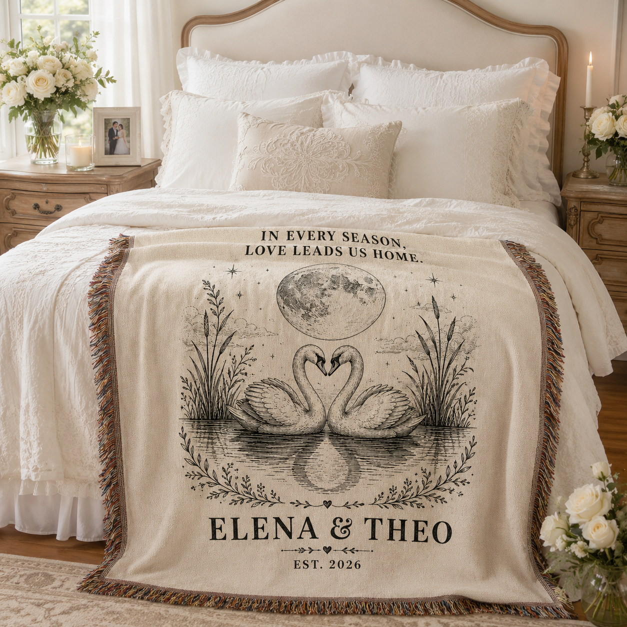 Personalized swan wedding woven blanket styled across a romantic bedroom bed