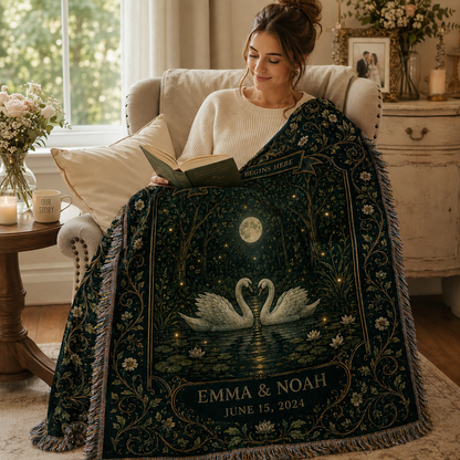 Woman reading with a personalized swan wedding woven blanket featuring custom couple names and date