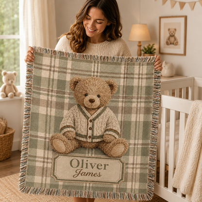 Personalized teddy bear plaid woven blanket displayed on a nursery crib