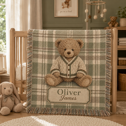 Personalized teddy bear plaid woven blanket styled on a cozy nursery daybed