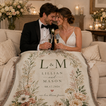 Newlywed couple celebrating with a personalized botanical woven wedding blanket