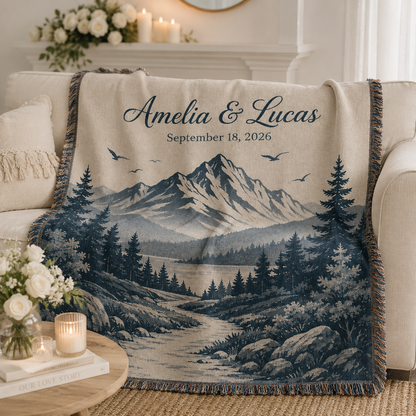 Personalized mountain wedding woven blanket softly draped on a neutral sofa
