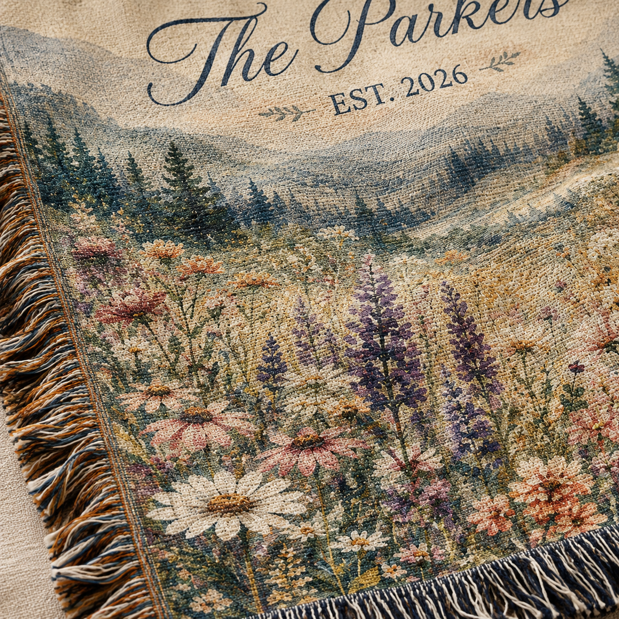 Macro detail of woven texture and multicolor fringe on personalized wildflower wedding blanket
