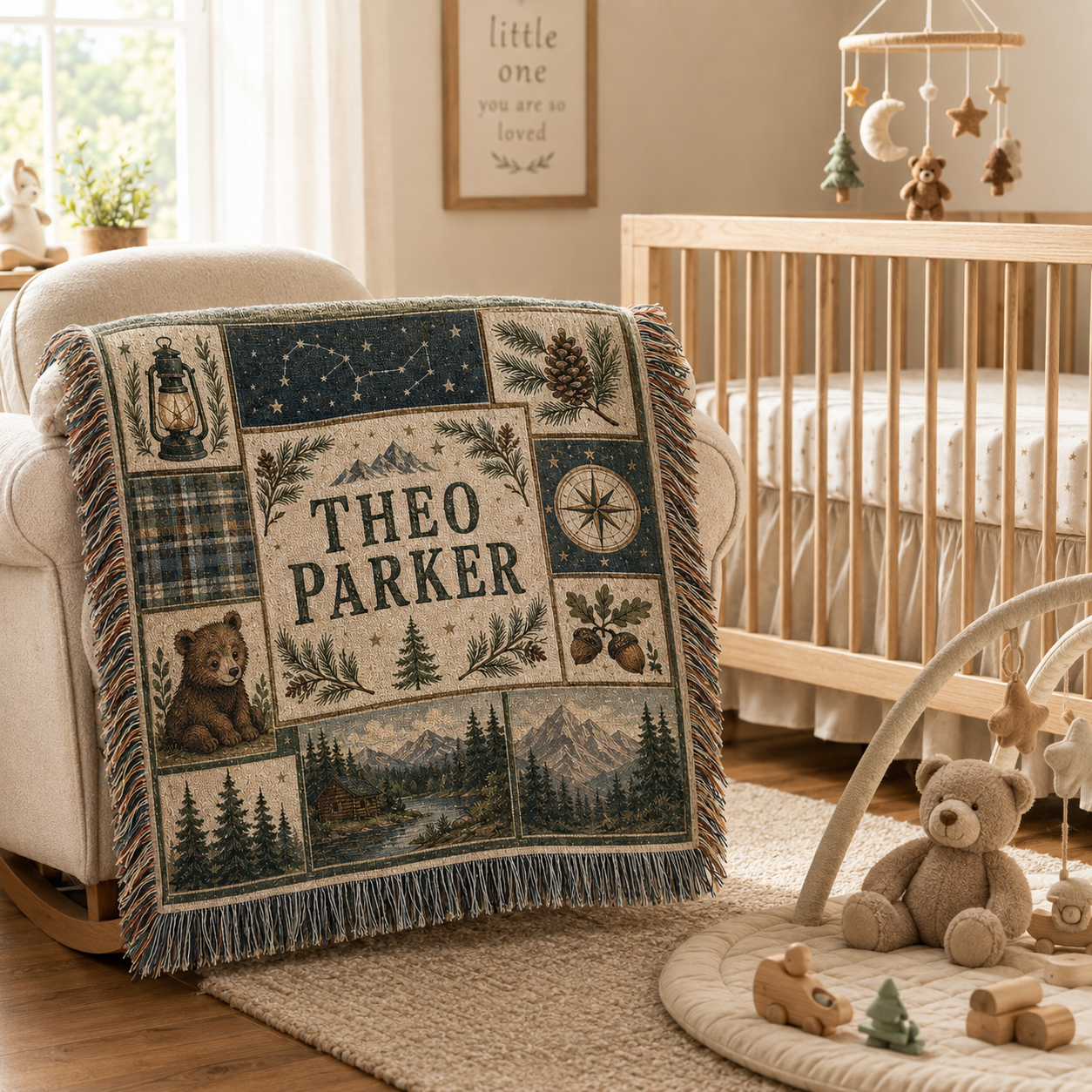 Personalized woodland adventure woven blanket styled beside a crib in a cozy nursery