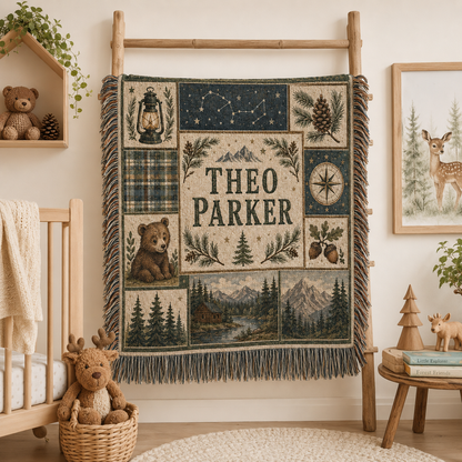 Custom name woodland adventure woven blanket displayed on a nursery blanket ladder