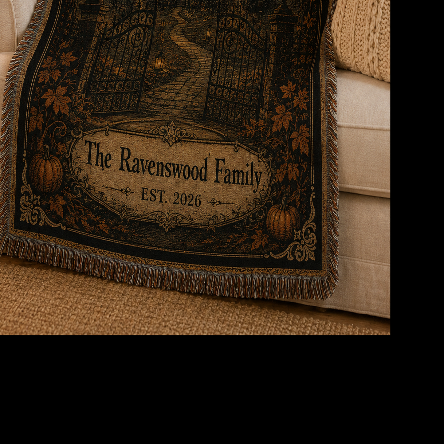 Close-up of personalized family surname, established year, pumpkins and decorative fringe on the Halloween woven blanket
