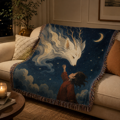 Spirit fox woven blanket displayed on a neutral living room sofa