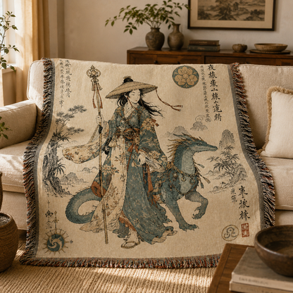 Dragon traveler woven blanket draped over a cream sofa in a warm East Asian inspired living room