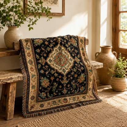 Vintage floral medallion woven blanket styled on a rustic wooden bench