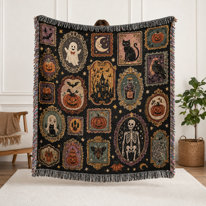 Vintage Halloween gallery woven blanket with framed ghost, black cat, haunted house, skeleton, pumpkins and fringe