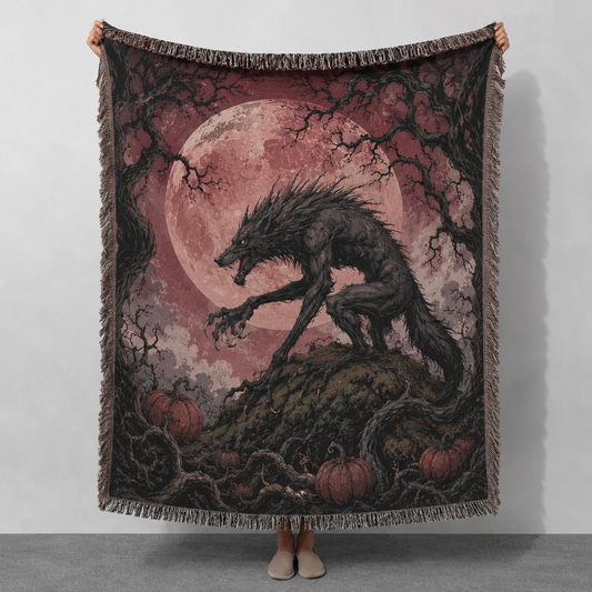 Gothic Halloween werewolf woven blanket with dusty rose full moon, twisted branches and pumpkins