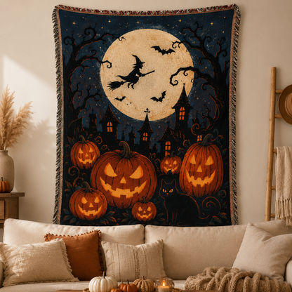 Halloween woven blanket with full moon, flying witch, jack-o-lantern pumpkins, black cat and fringe