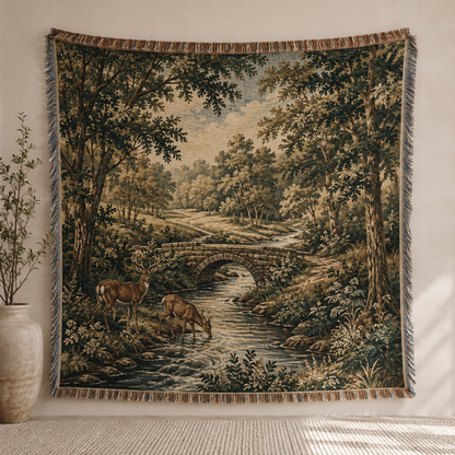 Woodland deer stream woven blanket shown full front with stone bridge and fringe