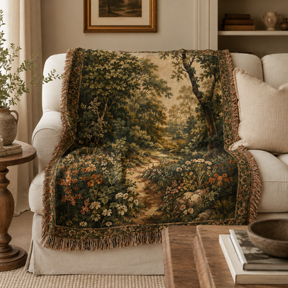 Woodland garden woven blanket draped over a cream sofa in a warm living room