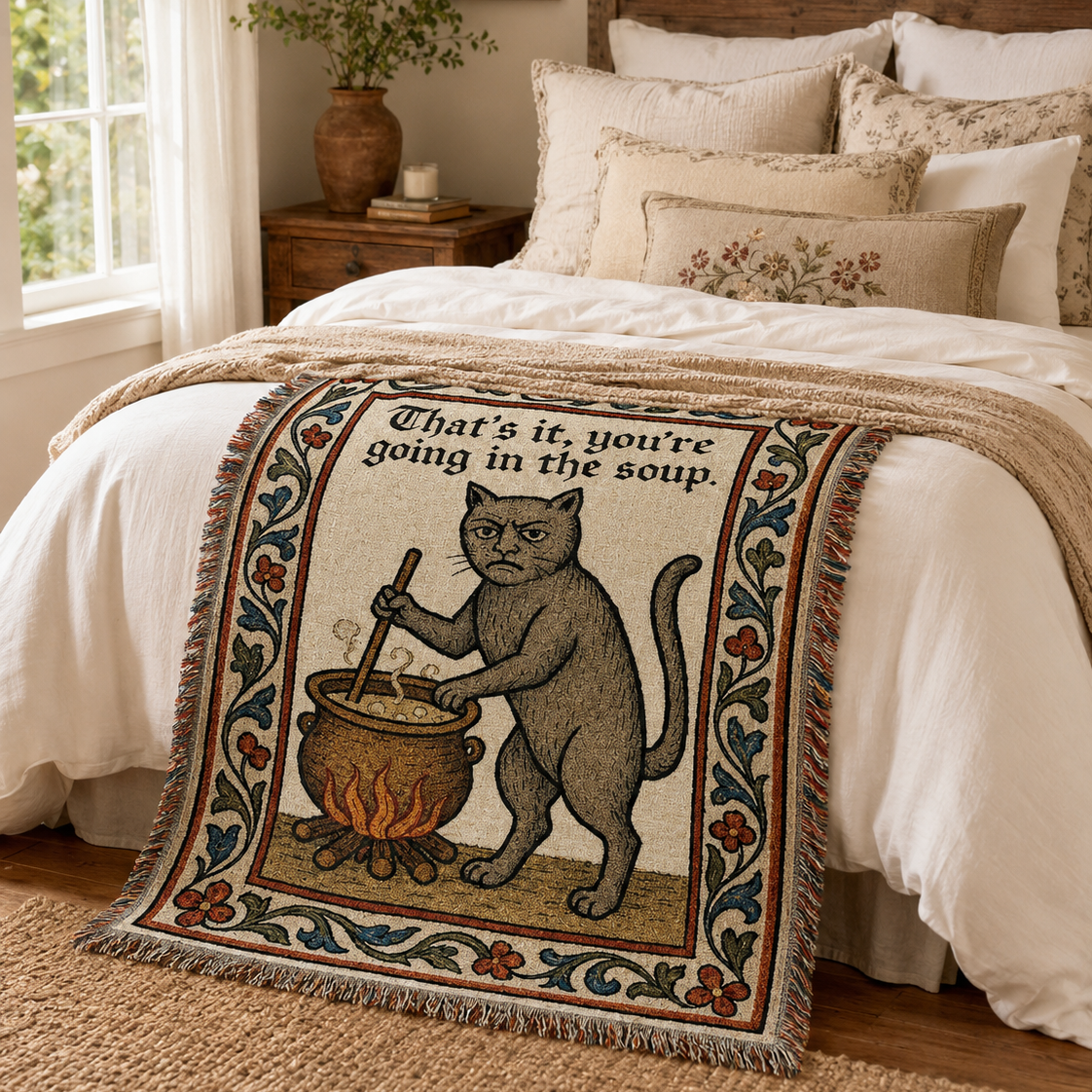 Funny medieval cat woven blanket in a cozy bedroom