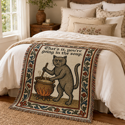 Funny medieval cat woven blanket in a cozy bedroom
