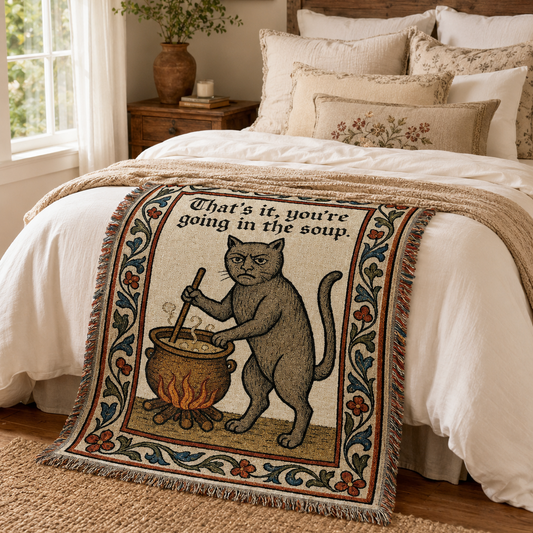 Funny medieval cat woven blanket in a cozy bedroom